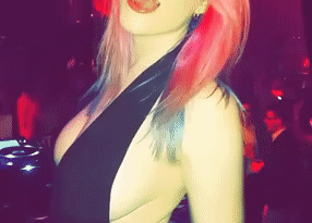 honey-with-rosy-hair-demonstrating-one-of-her-pierced-nips