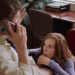 assistant-blows-her-chief-while-he-speaks-to-his-wifey-on-the-smartphone.