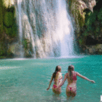 two-nymphs-in-knickers-jumping-into-lake
