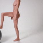 nude-blonde-plays-and-crushes-a-gym-ball