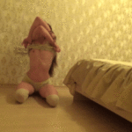 smallish-bombshell-striptease-in-bedroom